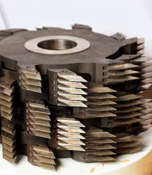 Close-up of stainless steel metal chucks and cutters for cutting wood.